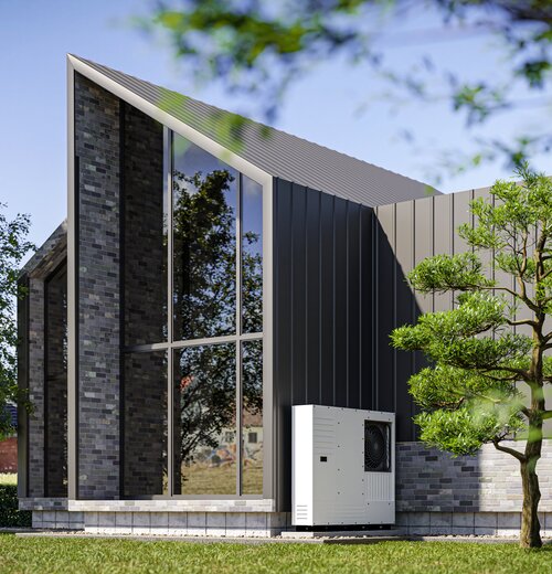 Modernes Gebäude mit Wärmepumpe im Grünen – Symbol für klimafreundliches Heizen und Energiewende im Gebäudesektor