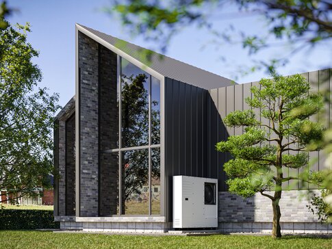 Modernes Gebäude mit Wärmepumpe im Grünen – Symbol für klimafreundliches Heizen und Energiewende im Gebäudesektor